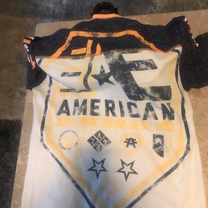 American fighter women’s tee orange and blue